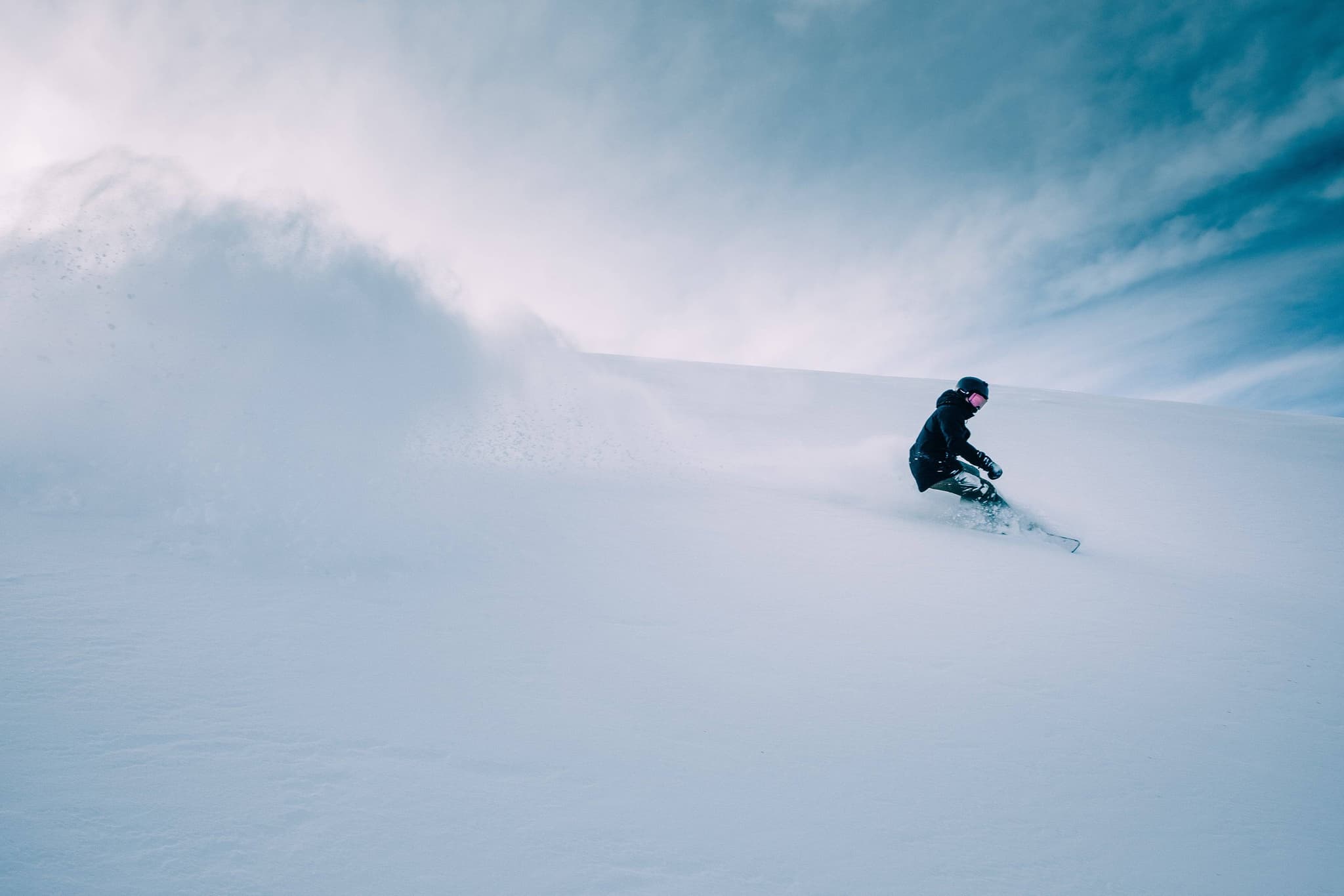 Operation Overlord snowboarder carving powder.